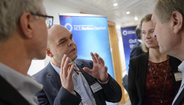 Bilde fra en person som forklarer i en konferanse